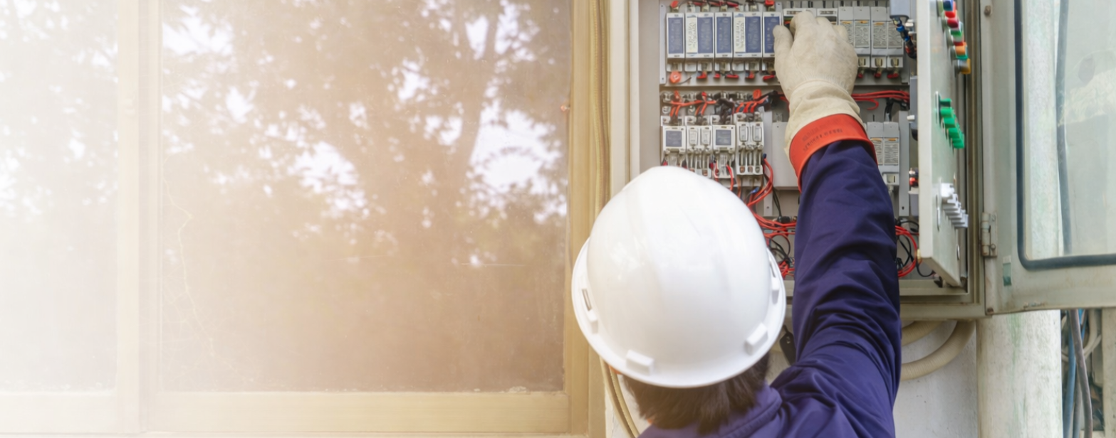Technician fixing electrical wiring 